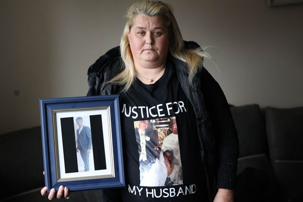 22/11/23 - Elizabeth Cash holding a framed photo of her husband Johnny who was killed by her brother Andy Cash and found guilty for the offence