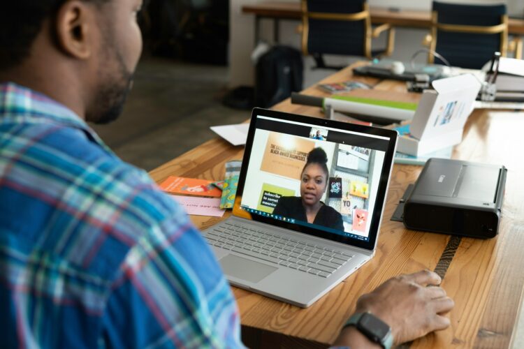 A virtual coaching session focused on teacher recruitment and development between two individuals